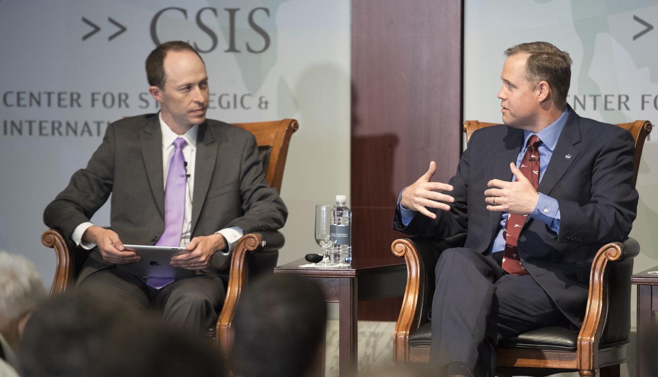 Todd Harrison, director of defense budget analysis and the aerospace security project, and senior fellow in the international security program at the Center for Strategic and International Studies, left, leads a discussion with NASA Administrator Jim Bridenstine, right, during an event celebrating NASA's 60th anniversary at the Center for Strategic and International Studies on Monday, July 23, 2018 in Washington. Bridenstine, and former NASA Administrators Sean O'Keefe and Charles Bolden answered questions about the past and future of the agency. (Photo Credit: NASA/Joel Kowsky)