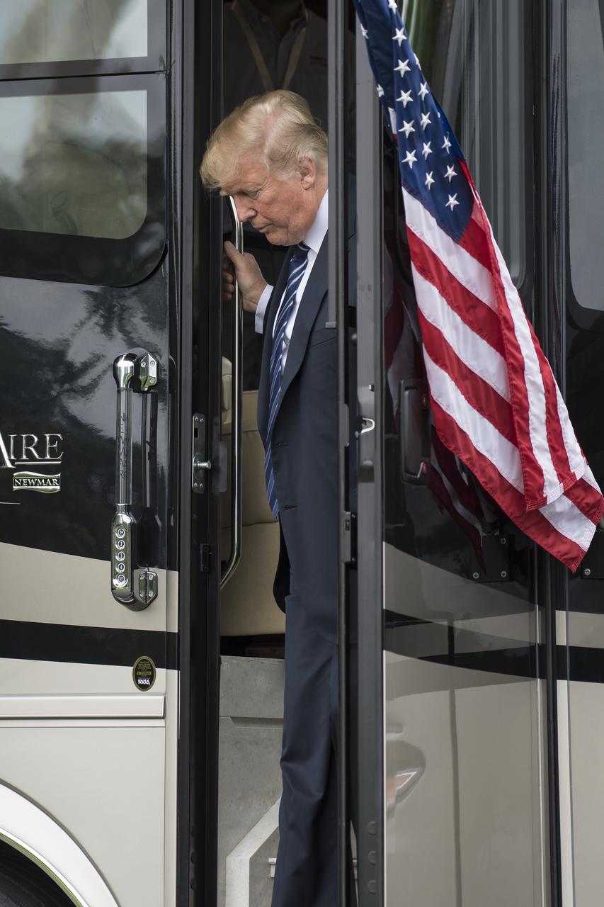 President Donald Trump tours a bus during the Made in America Product Showcase at the White House, Monday, July 23, 2018 in Washington. The Orion crew module that launched on Dec. 5, 2014 on the Exploration Flight Test-1 was also on display during the event. Lockheed Martin, NASA’s prime contractor for Orion, began manufacturing the Orion crew module in 2011 and delivered it in July 2012 to NASA's Kennedy Space Center where final assembly, integration and testing was completed. More than 1,000 companies across the country manufactured or contributed elements to the spacecraft. Photo Credit: (NASA/Aubrey Gemignani)