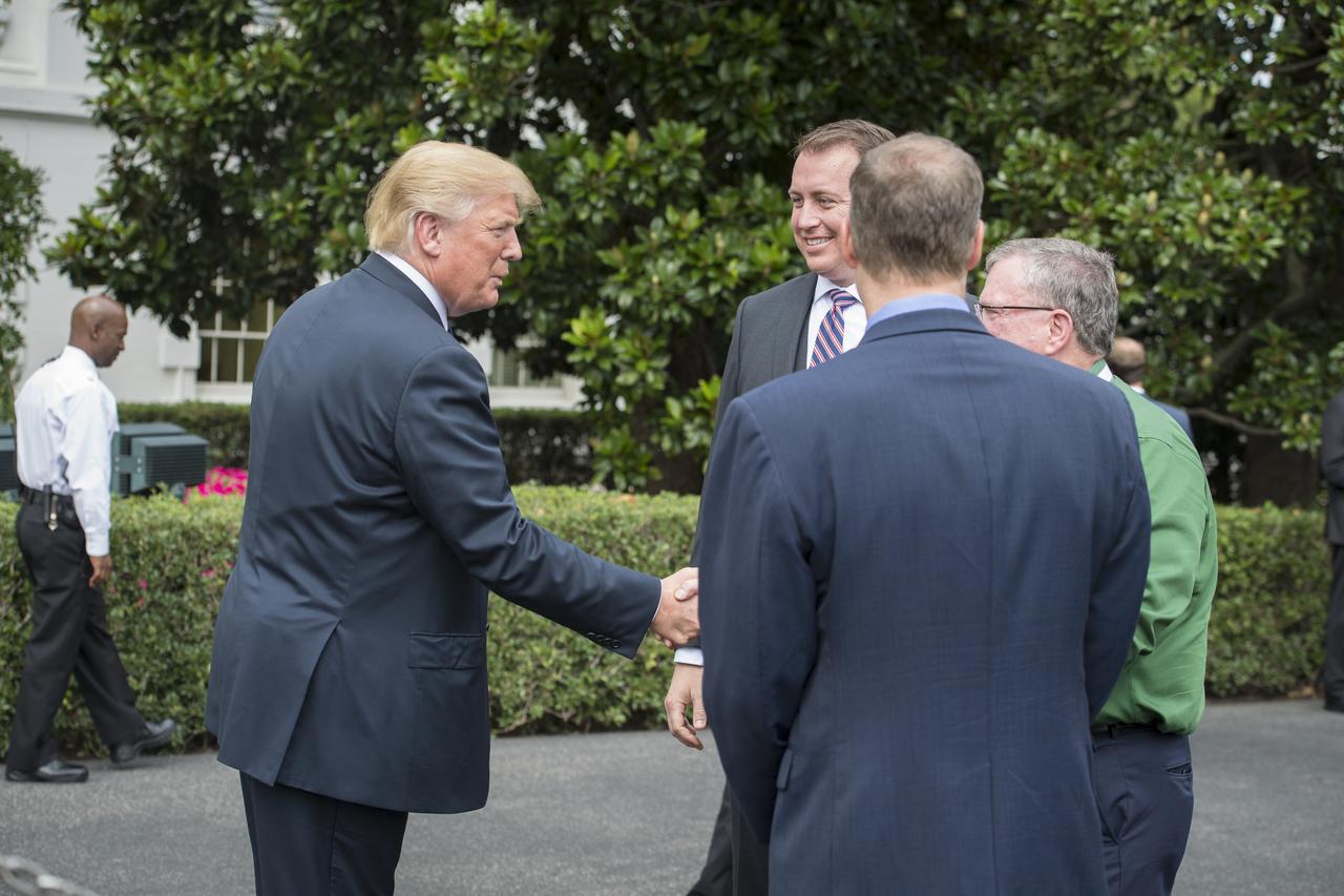 President Donald Trump meets NASA Administrator Jim Bridenstine, front, NASA Chief Financial Officer Jeff DeWitt, second from left, and Orion Program Manager, W. Michael Hawes, right, during a Made in America Product Showcase at the White House, Monday, July 23, 2018 in Washington. The Orion crew module that launched on Dec. 5, 2014 on the Exploration Flight Test-1 was also on display during the event. Lockheed Martin, NASA’s prime contractor for Orion, began manufacturing the Orion crew module in 2011 and delivered it in July 2012 to NASA's Kennedy Space Center where final assembly, integration and testing was completed. More than 1,000 companies across the country manufactured or contributed elements to the spacecraft. Photo Credit: (NASA/Aubrey Gemignani)