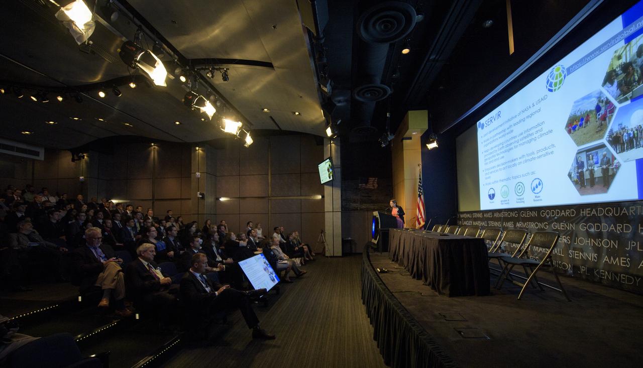 Capacity Building Program Manager for NASA's Applied Sciences Program (Earth Science Division) Nancy Searby speaks during the 2018 Annual Earth Science Applications Showcase, Wednesday, Aug. 1, 2018 at NASA Headquarters in Washington. Every summer students and young professionals from NASA’s Applied Sciences’ DEVELOP National Program come to NASA Headquarters and present their research projects. DEVELOP is a training and development program where students work on Earth science research projects, mentored by science advisers from NASA and partner agencies, and extend research results to local communities.  Photo Credit: (NASA/Joel Kowsky)