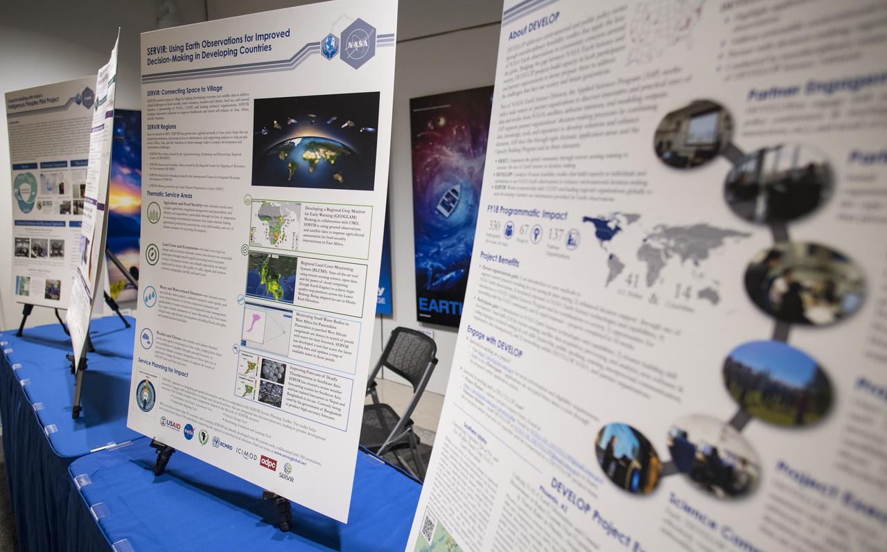 Posters are seen at the Earth Science Applications Showcase Wednesday, August 1, 2018 at NASA Headquarters in Washington. Every summer, participants in NASA’s Applied Sciences’ DEVELOP National Program come to NASA Headquarters and present their research projects. DEVELOP is a training and development program where students work on Earth science research projects, mentored by science advisers from NASA and partner agencies, and extend research results to local communities. Photo Credit: (NASA/Aubrey Gemignani)