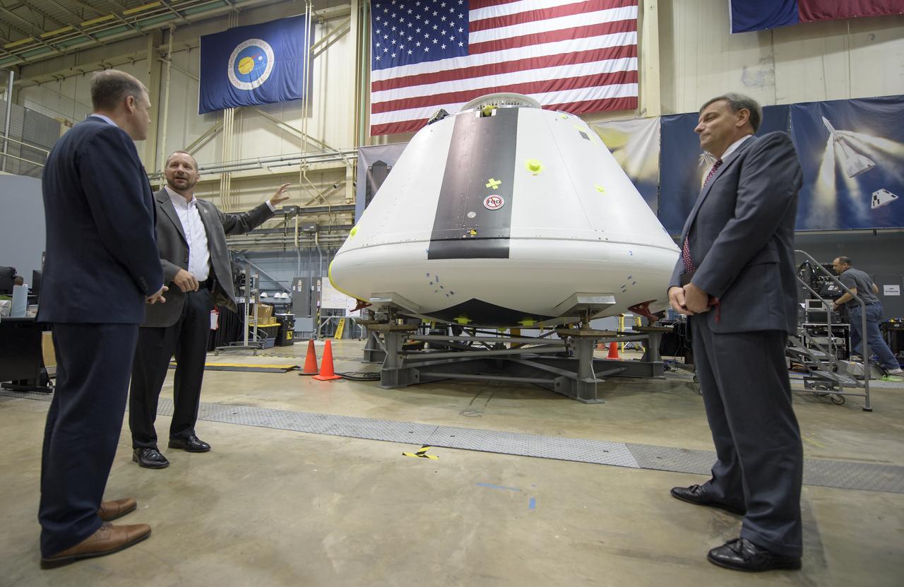 NASA Administrator Jim Bridenstine, left, is shown the Orion test crew capsule that will be used for the Ascent Abort-2 (AA-2) test by Orion AA-2 Crew Module Manager Dr. Jon Olansen, 2nd from left, as Orion Program Manager Mark Kirasich, right, looks on, Thursday, Aug. 2, 2018 at NASA’s Johnson Space Center in Houston, Texas. Photo Credit: (NASA/Bill Ingalls)