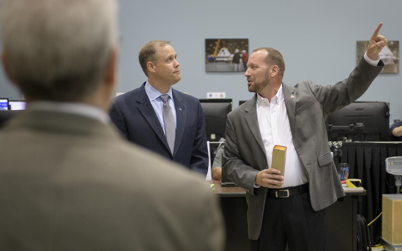 NASA Administrator Jim Bridenstine, left, listens as Orion AA-2 Crew Module Manager Dr. Jon Olansen discusses the Orion test crew capsule that will be used for the Ascent Abort-2 (AA-2) test, Thursday, Aug. 2, 2018 at NASA’s Johnson Space Center in Houston, Texas. Photo Credit: (NASA/Bill Ingalls)