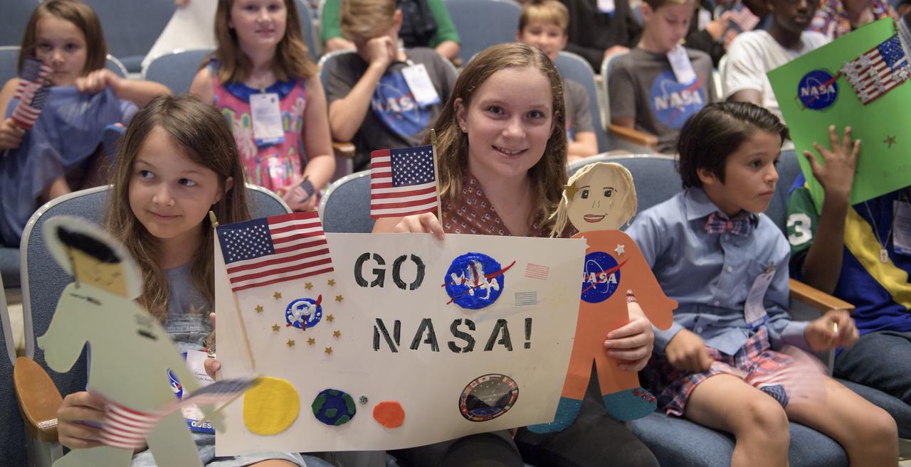 Local area school children are seen during a NASA event announcing the astronauts assigned to crew the first flight tests and missions of the Boeing CST-100 Starliner and SpaceX Crew Dragon, Friday, Aug. 3, 2018 at NASA’s Johnson Space Center in Houston, Texas. Photo Credit: (NASA/Bill Ingalls)
