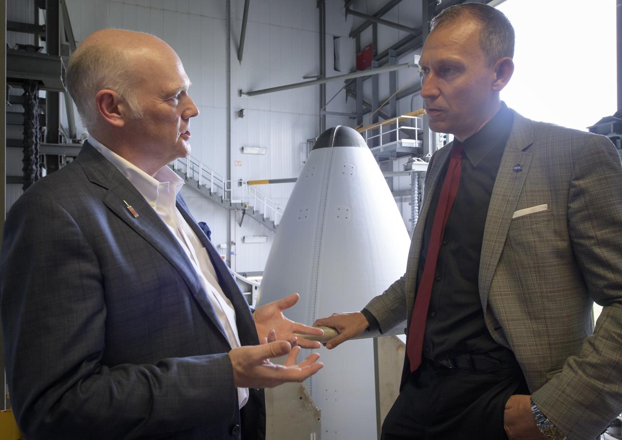 President and Chief Executive Officer for United Launch Alliance Tory Bruno, left, and NASA Associate Administrator for the Science Mission Directorate Thomas Zurbuchen talk while viewing the top of the ULA Delta IV Heavy rocket with NASA's Parker Solar onboard, Friday, Aug. 10, 2018, Launch Complex 37 at Cape Canaveral Air Force Station, Florida. This is the first NASA mission that has been named for a living individual. Parker Solar Probe is humanity’s first-ever mission into a part of the Sun’s atmosphere called the corona. Here it will directly explore solar processes that are key to understanding and forecasting space weather events that can impact life on Earth. Photo Credit: (NASA/Bill Ingalls)