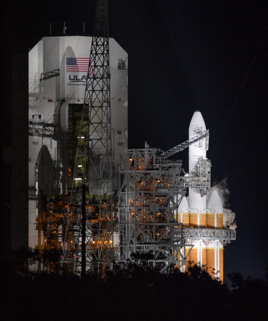 The United Launch Alliance Delta IV Heavy rocket with the Parker Solar Probe onboard is seen moments before launch, Sunday, Aug. 12, 2018, Launch Complex 37 at Cape Canaveral Air Force Station in Florida. Parker Solar Probe is humanity’s first-ever mission into a part of the Sun’s atmosphere called the corona.  Here it will directly explore solar processes that are key to understanding and forecasting space weather events that can impact life on Earth. Photo Credit: (NASA/Bill Ingalls)
