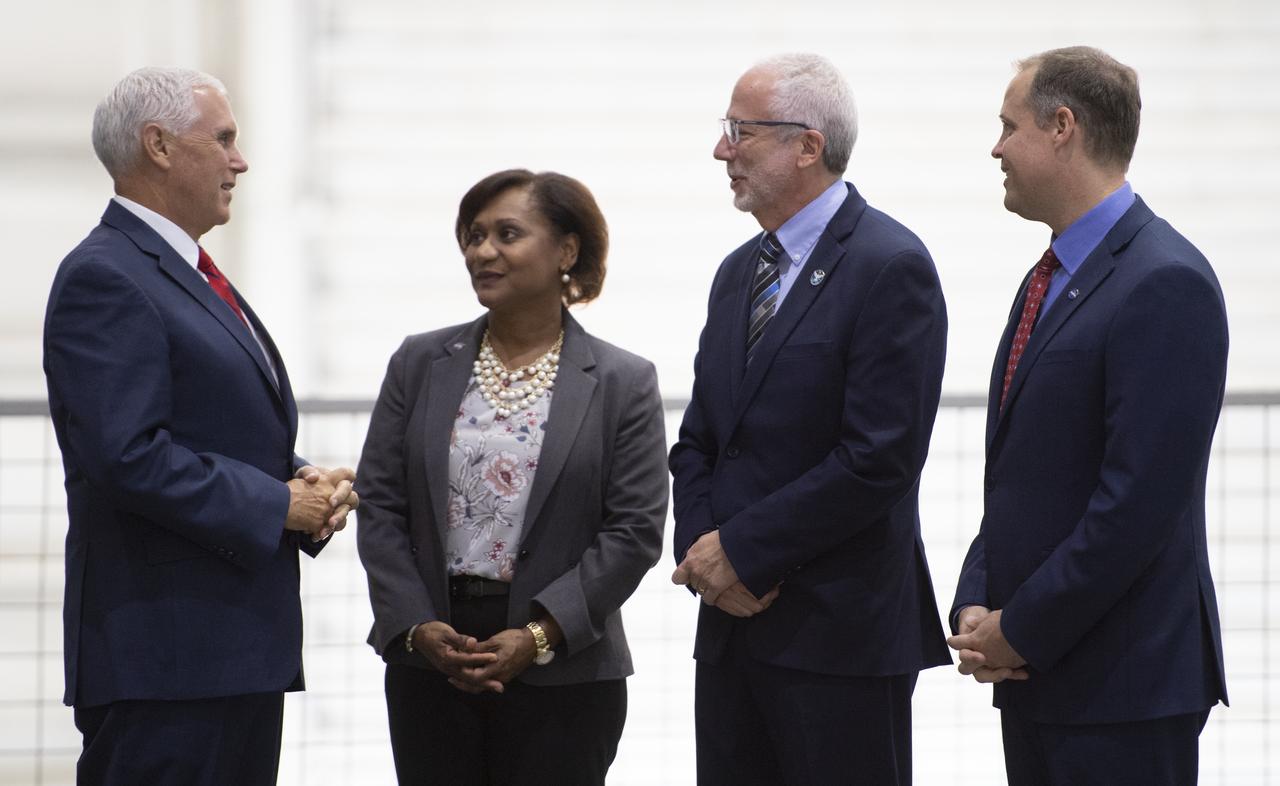 Vice President Mike Pence, left, speaks with Deputy Director of NASA's Johnson Space Center Vanessa Wyche, second from left, Director of NASA's Johnson Space Center Mark Geyer, second from right, and NASA Administrator Jim Bridenstine, right, during a tour of the Neutral Buoyancy Laboratory at NASA's Johnson Space Center, Thursday, Aug. 23, 2018 in Houston, Texas.  Photo Credit: (NASA/Joel Kowsky)