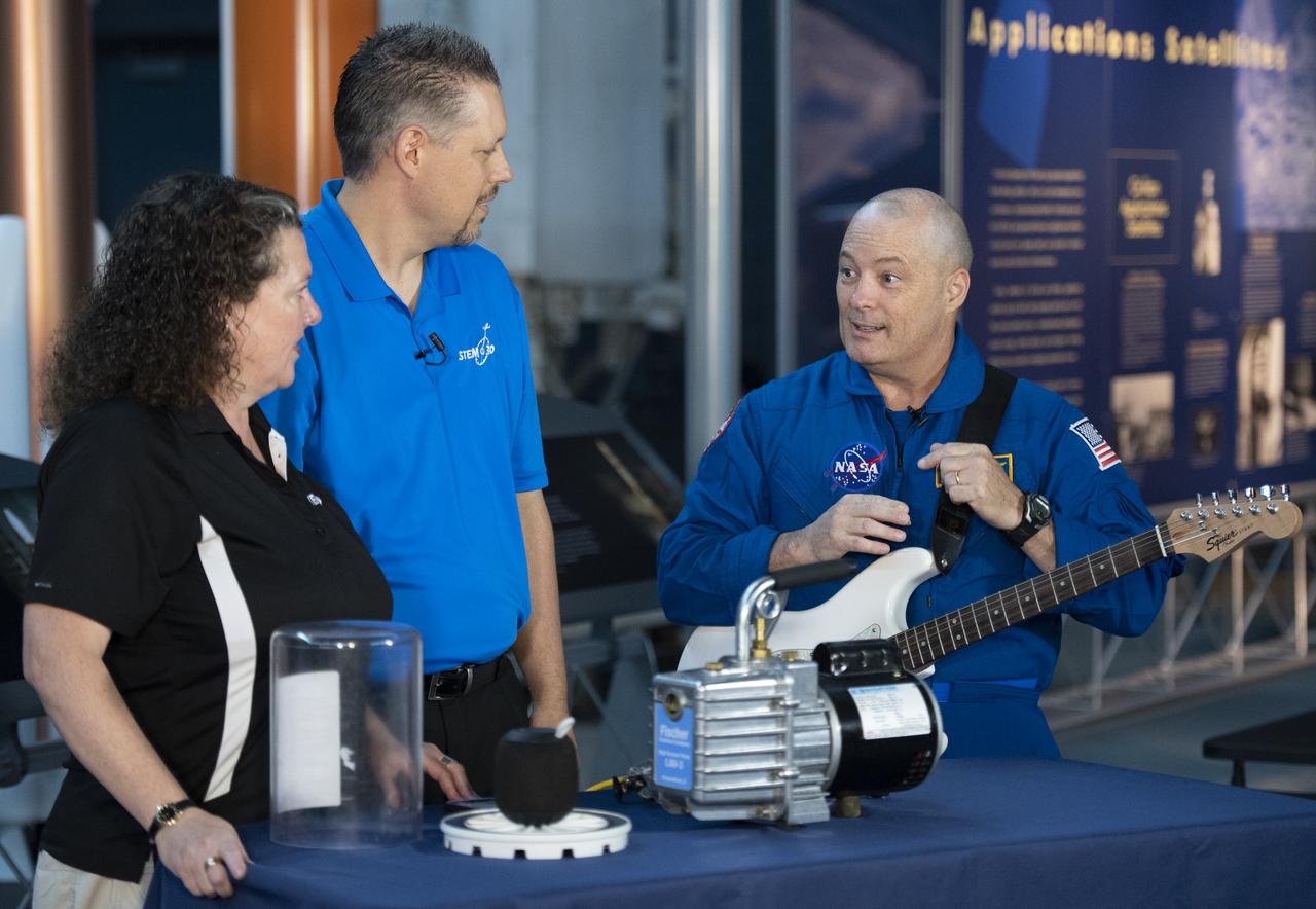 NASA astronaut Scott Tingle helps conduct an experiment about sound waves in a vacuum during a taping of STEM in 30 with Beth Wilson and Marty Kelsey, Wednesday, Sept. 12, 2018 at the Smithsonian National Air and Space Museum's Steven F. Udvar-Hazy Center in Chantilly, Va. Tingle spent 168 days onboard the International Space Station as part of Expeditions 54 and 55. Photo Credit: (NASA/Joel Kowsky)