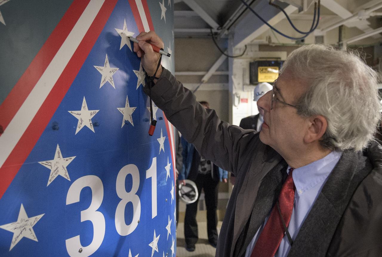 Michael Freilich, director of NASA’s Earth Science Division, NASA Headquarters, signs a star on the United Launch Alliance Delta II with the NASA Ice, Cloud and land Elevation Satellite-2 (ICESat-2) onboard, Thursday, Sept. 13, 2018, at Vandenberg Air Force Base in California. This will be the final launch of a Delta II rocket. The “381” on the rocket signifies that this is the 381st flight in the Delta family. The first Delta I was launched in May 1960. A star traditionally was placed on the rocket to recognize each mission. For the final Delta II, stars were sent to team members and partners throughout the nation. This rocket boasts more than 150 stars with over 800 signatures of people who have been part of the Delta II program. The ICESat-2 mission will measure the changing height of Earth's ice. Photo Credit: (NASA/Bill Ingalls)