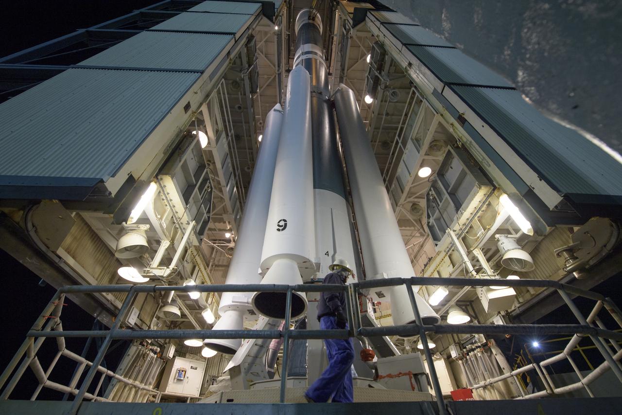 Workers prepare the United Launch Alliance (ULA) Delta II rocket, with the NASA Ice, Cloud and land Elevation Satellite-2 (ICESat-2) onboard, for launch, Friday, Sept. 14, 2018, at Vandenberg Air Force Base in California. The ICESat-2 mission will measure the changing height of Earth's ice. Photo Credit: (NASA/Bill Ingalls)
