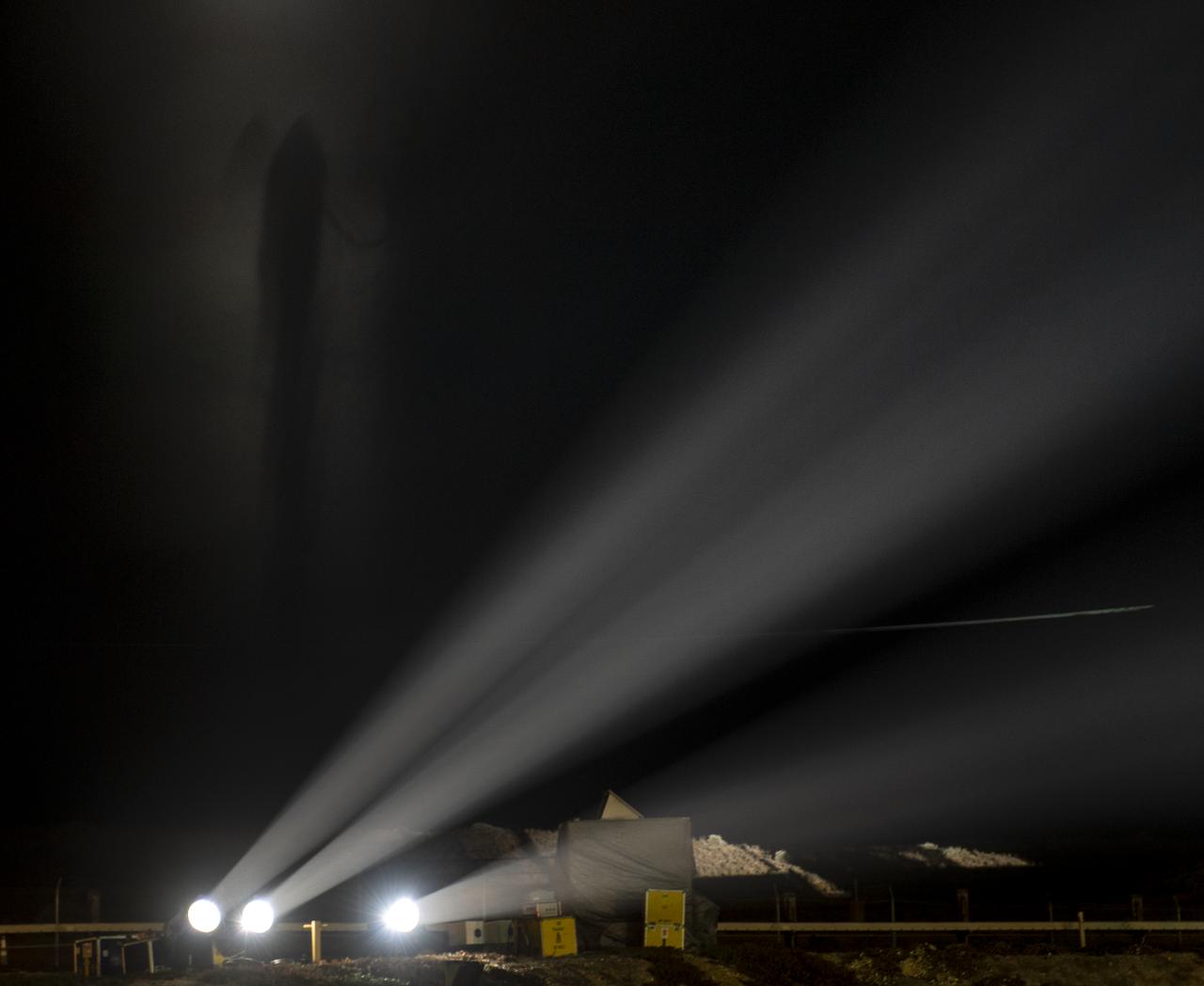 The silhouette of the United Launch Alliance (ULA) Delta II rocket, with the NASA Ice, Cloud and land Elevation Satellite-2 (ICESat-2) onboard, is seen in the fog shortly after the mobile service tower at SLC-2 was rolled back, Saturday, Sept. 15, 2018, at Vandenberg Air Force Base in California. The ICESat-2 mission will measure the changing height of Earth's ice. Photo Credit: (NASA/Bill Ingalls)