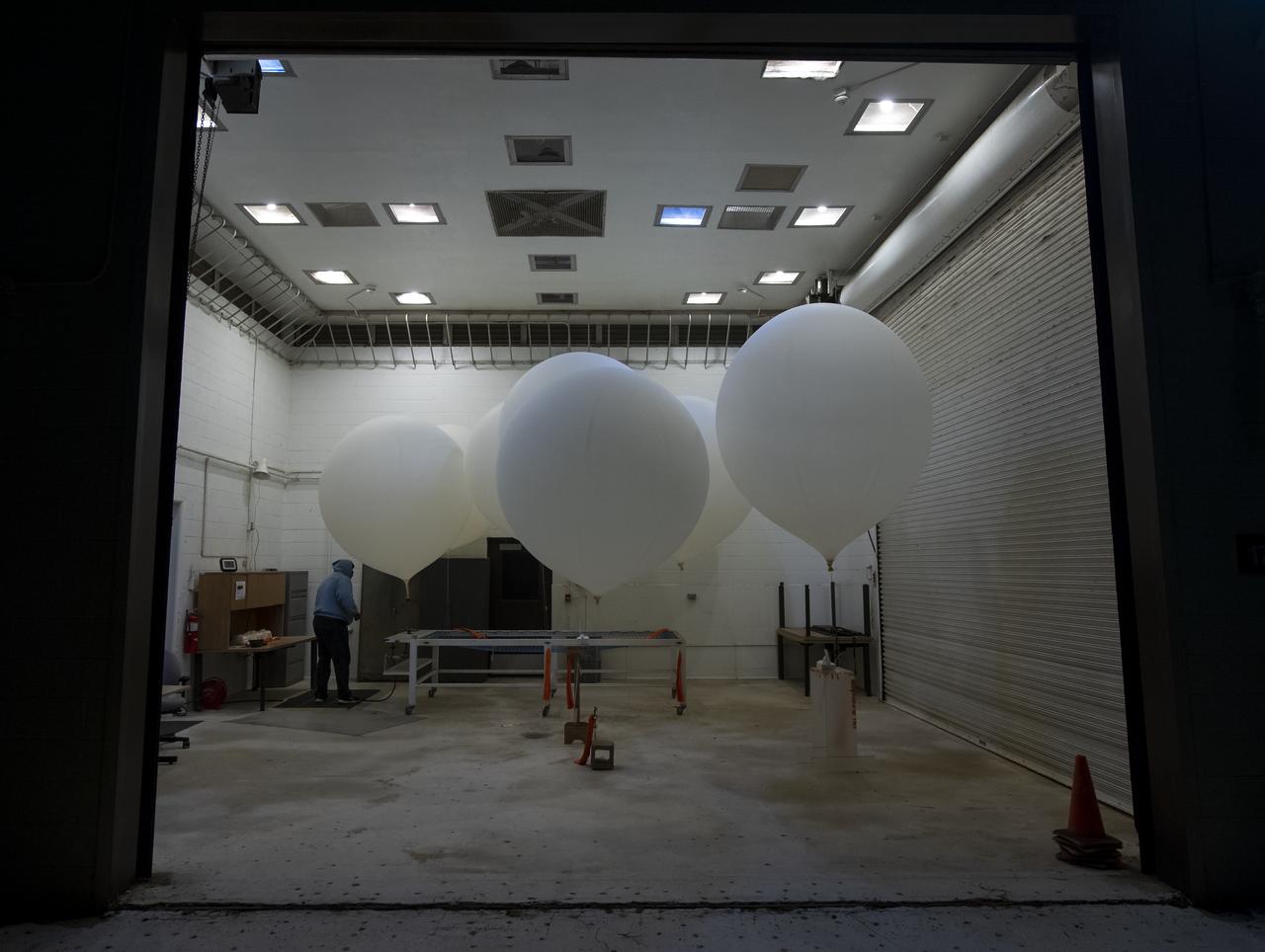 Weather balloons are prepared for release to help measure atmospheric conditions ahead of the launch of the NASA Ice, Cloud and land Elevation Satellite-2 (ICESat-2), Saturday, Sept. 15, 2018, Vandenberg Air Force Base in California. The ICESat-2 mission will measure the changing height of Earth's ice. Photo Credit: (NASA/Bill Ingalls)
