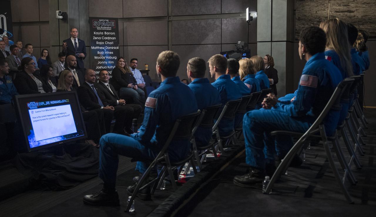 NASA Administrator Jim Bridenstine speaks with the agency's astronaut candidates during a live episode of the Administrator's monthly chat show, Watch This Space, Thursday, Sept. 27, 2018 in the Webb Auditorium at NASA Headquarters in Washington. NASA's newest astronaut candidate class has started their two years of training, after which the new astronaut candidates could be assigned to missions performing research on the International Space Station, launching from American soil on spacecraft built by commercial companies, and launching on deep space missions on NASA’s new Orion spacecraft and Space Launch System rocket. Photo Credit: (NASA/Joel Kowsky)