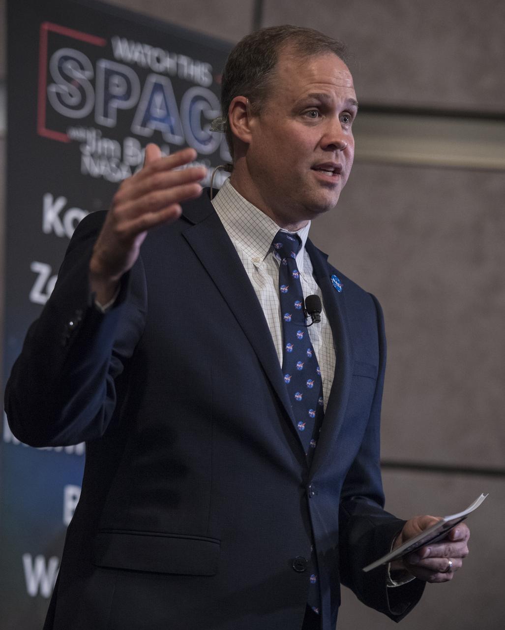 NASA Administrator Jim Bridenstine asks a question of the 2017 astronaut candidates during a live episode of the Administrator's monthly chat show, Watch This Space,  Thursday, Sept. 27, 2018 in the Webb Auditorium at NASA Headquarters in Washington. NASA's newest astronaut candidate class has started their two years of training, after which the new astronaut candidates could be assigned to missions performing research on the International Space Station, launching from American soil on spacecraft built by commercial companies, and launching on deep space missions on NASA’s new Orion spacecraft and Space Launch System rocket.  Photo Credit: (NASA/Joel Kowsky)