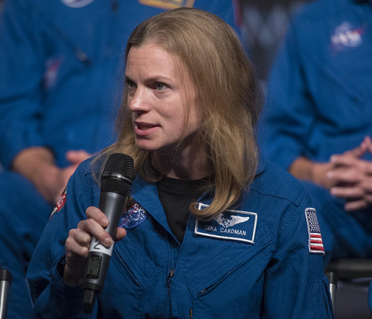 NASA astronaut candidate Zena Cardman answers a question during a live episode of the Administrator's monthly chat show, Watch This Space,  Thursday, Sept. 27, 2018 in the Webb Auditorium at NASA Headquarters in Washington. NASA's newest astronaut candidate class has started their two years of training, after which the new astronaut candidates could be assigned to missions performing research on the International Space Station, launching from American soil on spacecraft built by commercial companies, and launching on deep space missions on NASA’s new Orion spacecraft and Space Launch System rocket.  Photo Credit: (NASA/Joel Kowsky)
