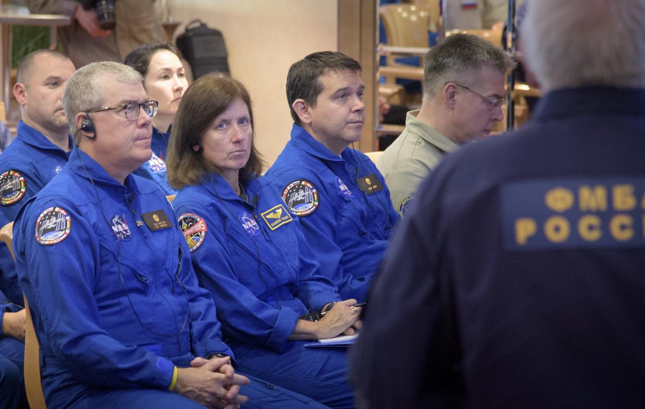 NASA Deputy International Space Station Program Manager Dan Hartman, left, NASA astronaut and Astronaut Office Representative Shannon Walker, center, and NASA Director for Human Space Flight Programs, Russia, Chad Rowe attend a NASA, Roscosmos, and Russian Search and Recovery Forces meeting to discuss the readiness for the landing of the Expedition 56 crew, Tuesday, Oct. 2, 2018. Expedition 56 crew members Drew Feustel and Ricky Arnold of NASA, along with Oleg Artemyev of Roscosmos are returning after 197 days in space where they served as members of the Expedition 55 and 56 crews onboard the International Space Station. Photo Credit: (NASA/Bill Ingalls)