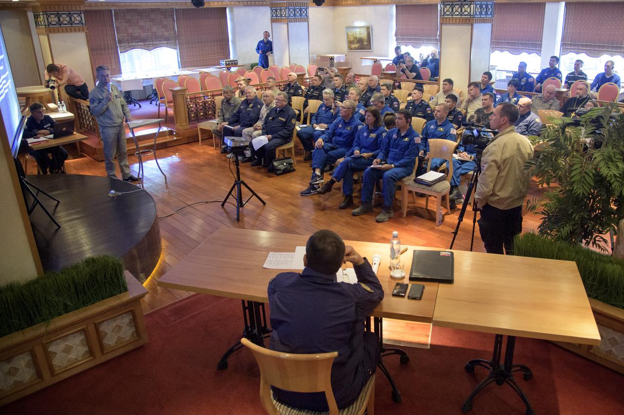 NASA and Roscosmos team members, along with Russian Search and Recovery Forces, meet at the Cosmonaut Hotel in Karaganda, Kazakhstan to discuss the readiness for the landing of Expedition 56 Commander Drew Feustel and Flight Engineer Ricky Arnold of NASA, along with Flight Engineer and Soyuz Commander Oleg Artemyev of Roscosmos Tuesday, Oct. 2, 2018. Feustel, Arnold, and Artemyev are returning after 197 days in space where they served as members of the Expedition 55 and 56 crews onboard the International Space Station. Photo Credit: (NASA/Bill Ingalls)