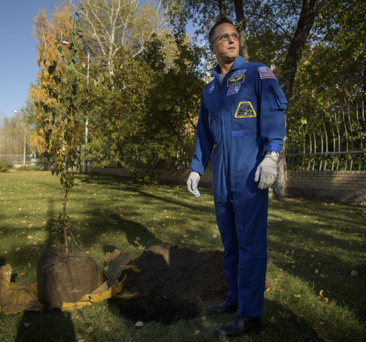 NASA astronaut and Director of Operations, Star City, Russia, Joe Acaba prepares to plant a tree during a traditional ceremony at the Cosmonaut Hotel in Karaganda, Kazakhstan, Tuesday, Oct. 2, 2018. Acaba is in Karaganda to help support the Expedition 56 crew Soyuz landing from the International Space Station. Photo Credit: (NASA/Bill Ingalls)
