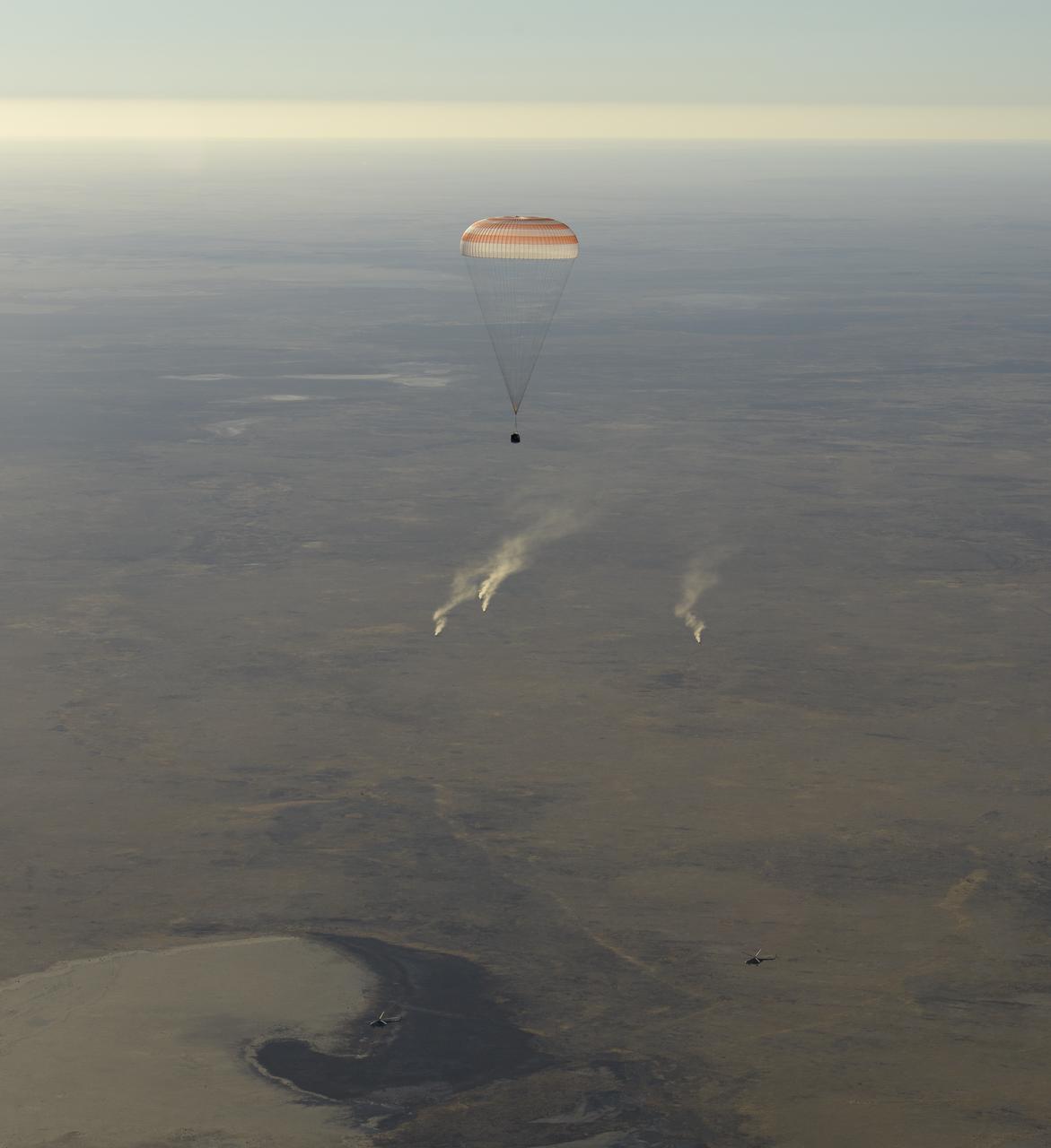 The Soyuz MS-08 spacecraft is seen as it lands with Expedition 56 Commander Drew Feustel and Flight Engineer Ricky Arnold of NASA, along with Flight Engineer and Soyuz Commander Oleg Artemyev of Roscosmos near the town of Zhezkazgan, Kazakhstan on Thursday, Oct. 4, 2018. Feustel, Arnold, and Artemyev are returning after 197 days in space where they served as members of the Expedition 55 and 56 crews onboard the International Space Station. Photo Credit: (NASA/Bill Ingalls)