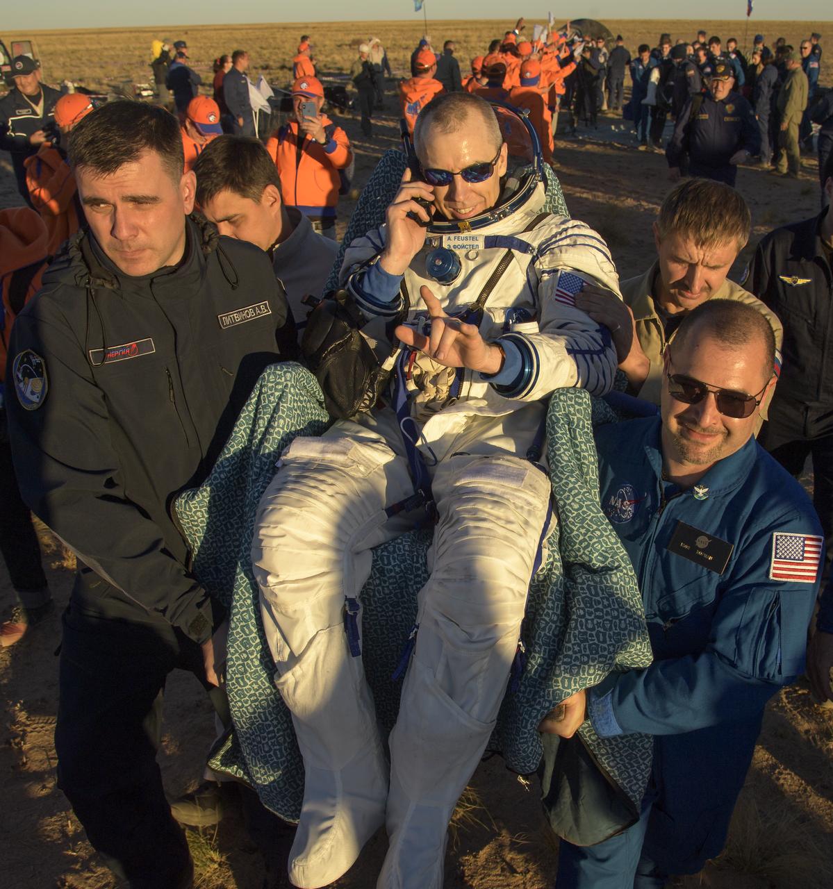 Expedition 56 Commander Drew Feustel of NASA is carried to a medical tent shortly after he, Expedition 56 Flight Engineer Ricky Arnold of NASA, and Expedition 56 Flight Engineer and Soyuz Commander Oleg Artemyev of Roscosmos landed in their Soyuz MS-08 spacecraft near the town of Zhezkazgan, Kazakhstan on Thursday, Oct. 4, 2018. Feustel, Arnold, and Artemyev are returning after 197 days in space where they served as members of the Expedition 55 and 56 crews onboard the International Space Station. Photo Credit: (NASA/Bill Ingalls)