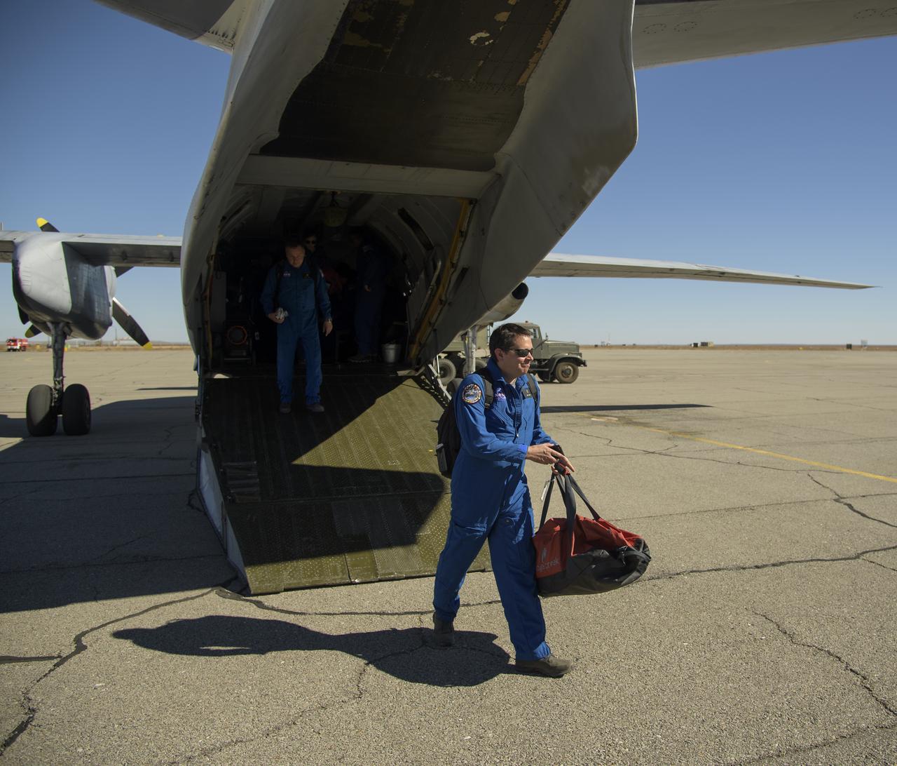 NASA Director for Human Space Flight Programs, Russia, Chad Rowe departs an AN-26 aircraft at the Zhezkazgan Airport in Kazakhstan to be in place for the Soyuz MS-08 spacecraft landing with Expedition 56 Commander Drew Feustel and Flight Engineer Ricky Arnold of NASA, along with Flight Engineer and Soyuz Commander Oleg Artemyev of Roscosmos on Thursday, Oct. 4, 2018. Feustel, Arnold, and Artemyev are returning after 197 days in space where they served as members of the Expedition 55 and 56 crews onboard the International Space Station. Photo Credit: (NASA/Bill Ingalls)