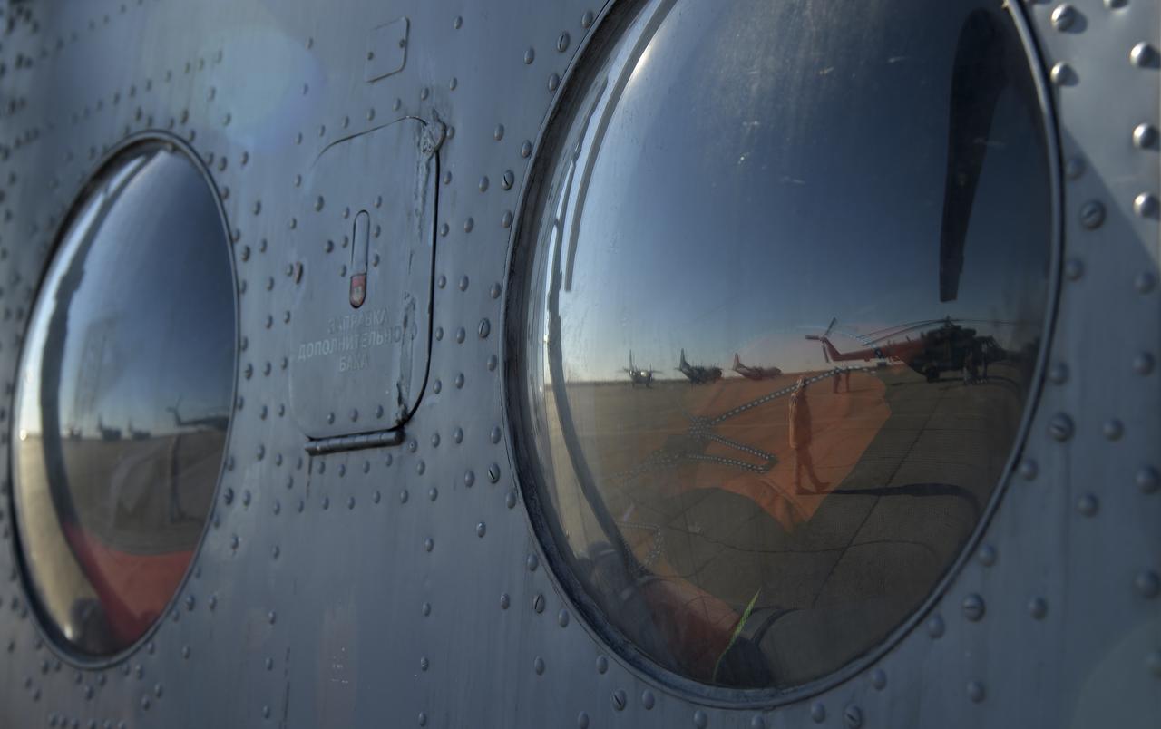 Russian MI-8 helicopters wait at the Zhezkazgan Airport in Kazakhstan to deploy to the Soyuz MS-08 spacecraft landing with Expedition 56 Commander Drew Feustel and Flight Engineer Ricky Arnold of NASA, along with Flight Engineer and Soyuz Commander Oleg Artemyev of Roscosmos, Thursday, Oct. 4, 2018. Feustel, Arnold, and Artemyev are returning after 197 days in space where they served as members of the Expedition 55 and 56 crews onboard the International Space Station. Photo Credit: (NASA/Bill Ingalls)