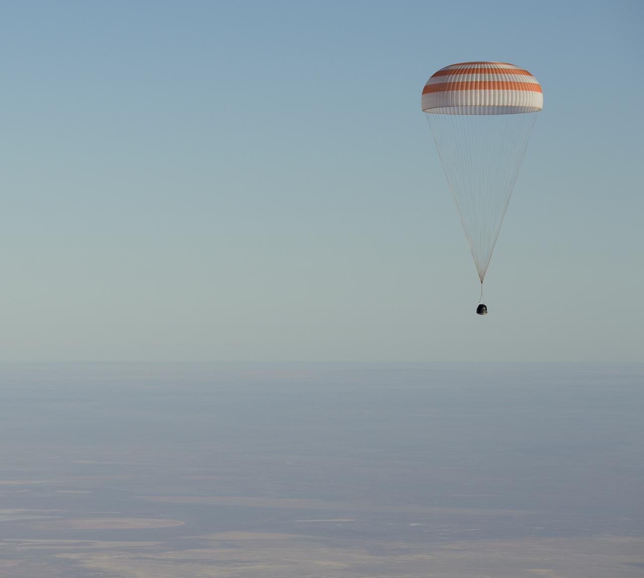 The Soyuz MS-08 spacecraft is seen as it lands with Expedition 56 Commander Drew Feustel and Flight Engineer Ricky Arnold of NASA, along with Flight Engineer and Soyuz Commander Oleg Artemyev of Roscosmos near the town of Zhezkazgan, Kazakhstan on Thursday, Oct. 4, 2018. Feustel, Arnold, and Artemyev are returning after 197 days in space where they served as members of the Expedition 55 and 56 crews onboard the International Space Station. Photo Credit: (NASA/Bill Ingalls)