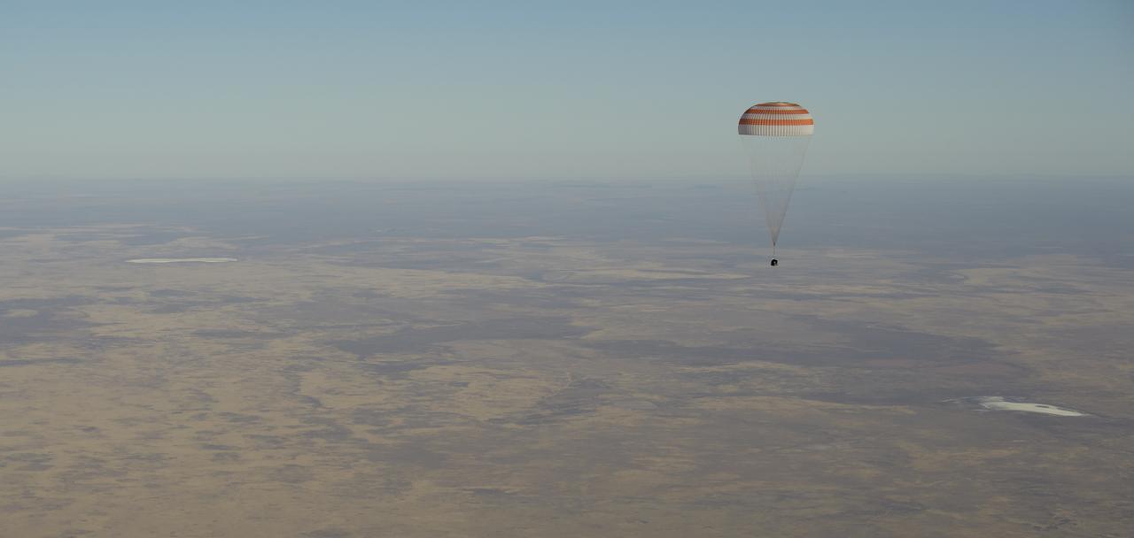 The Soyuz MS-08 spacecraft is seen as it lands with Expedition 56 Commander Drew Feustel and Flight Engineer Ricky Arnold of NASA, along with Flight Engineer and Soyuz Commander Oleg Artemyev of Roscosmos near the town of Zhezkazgan, Kazakhstan on Thursday, Oct. 4, 2018. Feustel, Arnold, and Artemyev are returning after 197 days in space where they served as members of the Expedition 55 and 56 crews onboard the International Space Station. Photo Credit: (NASA/Bill Ingalls)