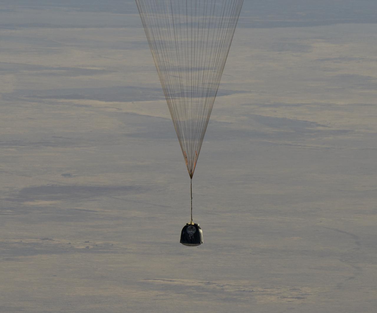 The Soyuz MS-08 spacecraft is seen as it lands with Expedition 56 Commander Drew Feustel and Flight Engineer Ricky Arnold of NASA, along with Flight Engineer and Soyuz Commander Oleg Artemyev of Roscosmos near the town of Zhezkazgan, Kazakhstan on Thursday, Oct. 4, 2018. Feustel, Arnold, and Artemyev are returning after 197 days in space where they served as members of the Expedition 55 and 56 crews onboard the International Space Station. Photo Credit: (NASA/Bill Ingalls)