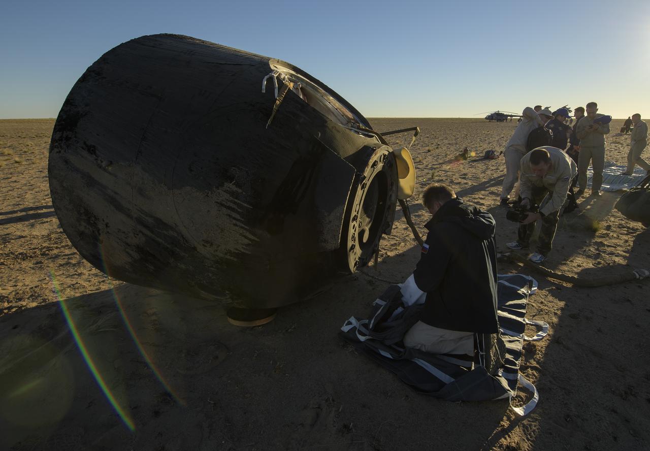 Russian Search and Rescue teams arrive at the Soyuz MS-08 spacecraft shortly after it landed with Expedition 56 Commander Drew Feustel and Flight Engineer Ricky Arnold of NASA, along with Flight Engineer and Soyuz Commander Oleg Artemyev of Roscosmos near the town of Zhezkazgan, Kazakhstan on Thursday, Oct. 4, 2018. Feustel, Arnold, and Artemyev are returning after 197 days in space where they served as members of the Expedition 55 and 56 crews onboard the International Space Station. Photo Credit: (NASA/Bill Ingalls)