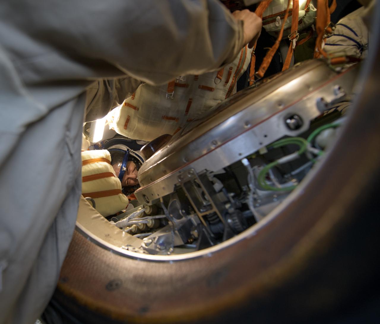 Expedition 56 Flight Engineer Ricky Arnold of NASA is helped out of the Soyuz MS-08 spacecraft just minutes after he, Expedition 56 Commander Drew Feustel of NASA, and Expedition 56 Flight Engineer and Soyuz Commander Oleg Artemyev of Roscosmos, landed in a remote area near the town of Zhezkazgan, Kazakhstan on Thursday, Oct. 4, 2018. Feustel, Arnold, and Artemyev are returning after 197 days in space where they served as members of the Expedition 55 and 56 crews onboard the International Space Station. Photo Credit: (NASA/Bill Ingalls)
