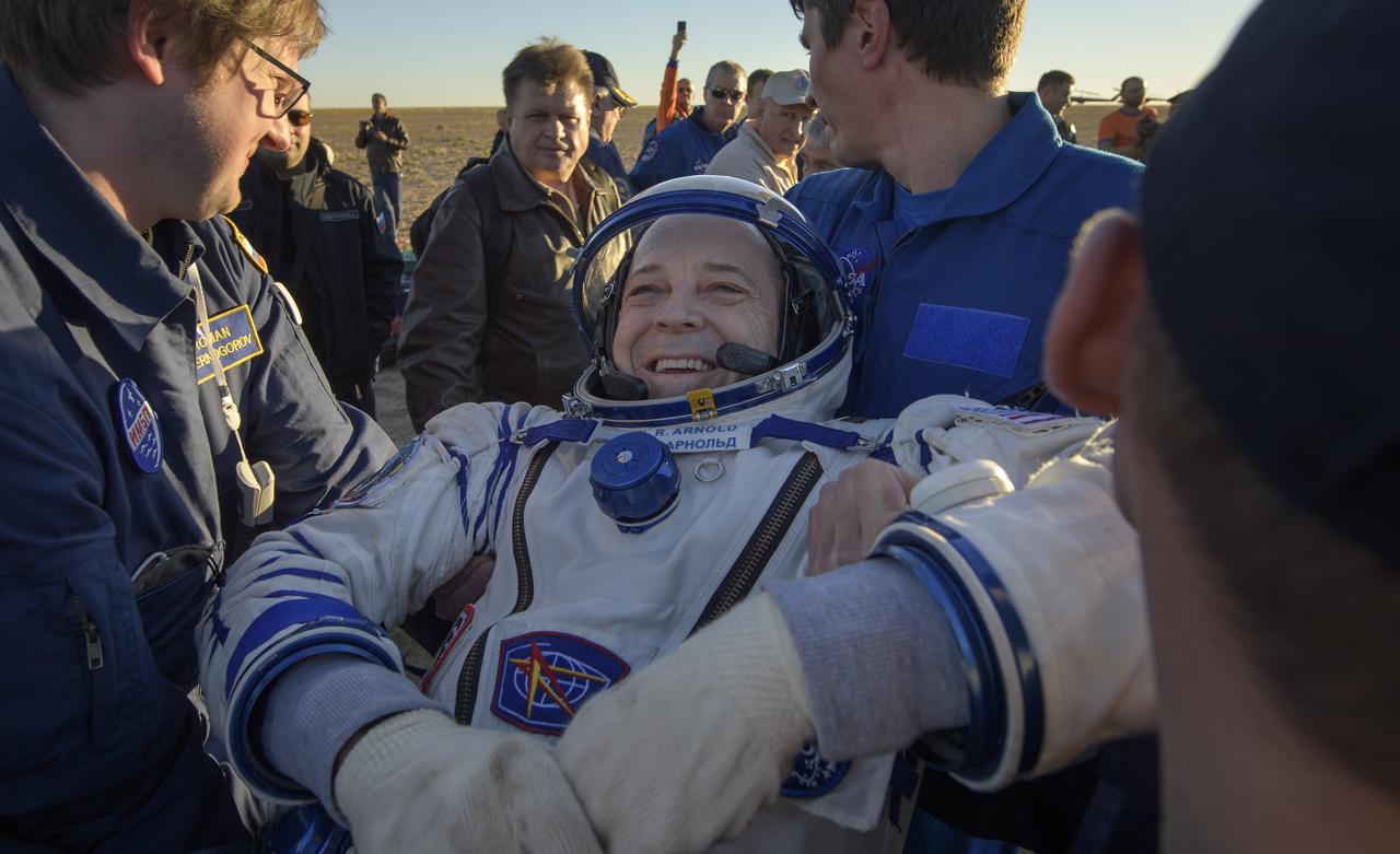 Expedition 56 Flight Engineer Ricky Arnold of NASA is helped out of the Soyuz MS-08 spacecraft just minutes after he, Expedition 56 Commander Drew Feustel of NASA, and Expedition 56 Flight Engineer and Soyuz Commander Oleg Artemyev of Roscosmos, landed in a remote area near the town of Zhezkazgan, Kazakhstan on Thursday, Oct. 4, 2018. Feustel, Arnold, and Artemyev are returning after 197 days in space where they served as members of the Expedition 55 and 56 crews onboard the International Space Station. Photo Credit: (NASA/Bill Ingalls)