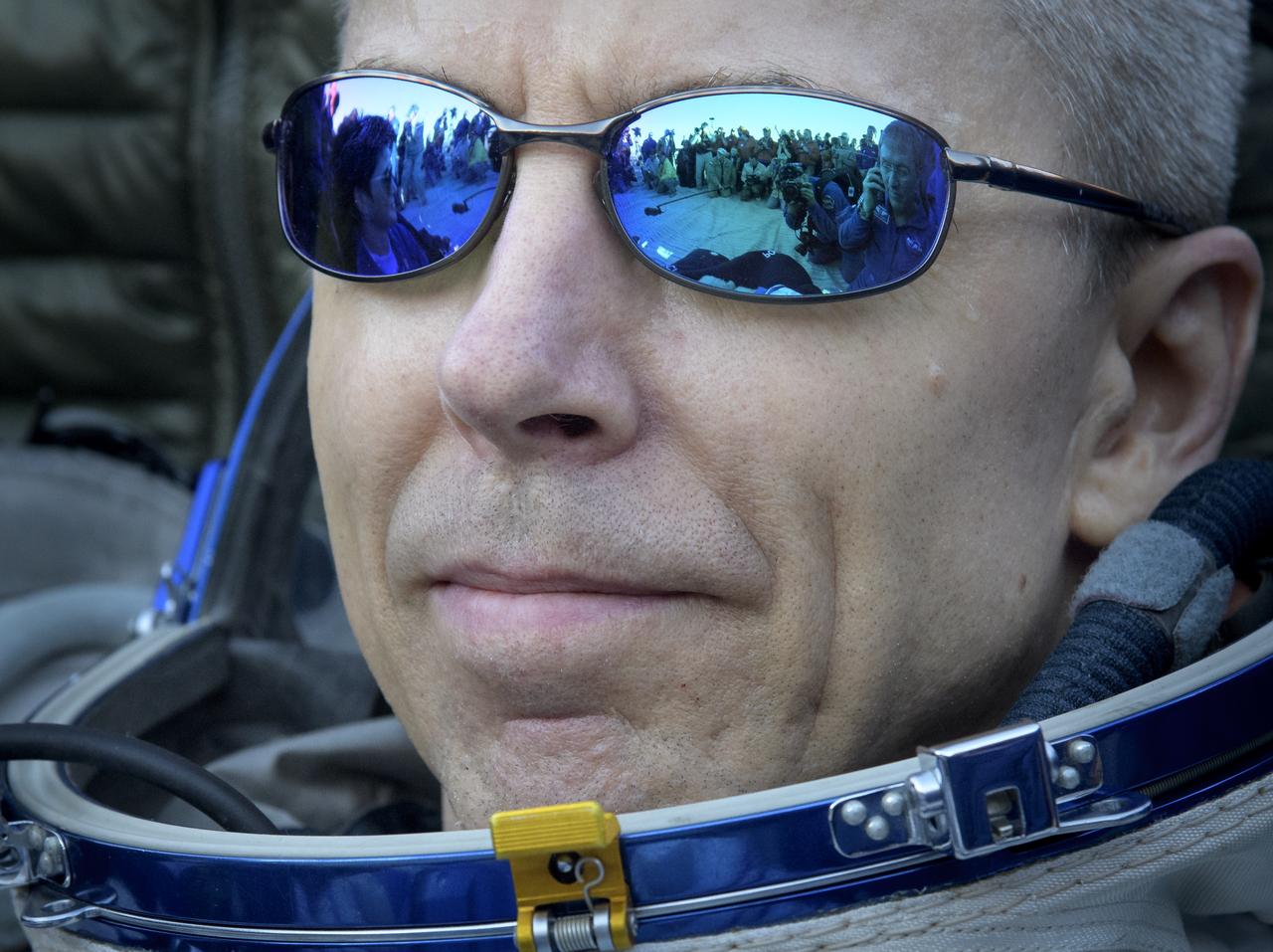 Expedition 56 Commander Drew Feustel of NASA rests outside the Soyuz Capsule after he, Expedition 56 Flight Engineer Ricky Arnold of NASA, and Expedition 56 Flight Engineer and Soyuz Commander Oleg Artemyev of Roscosmos, landed in a remote area near the town of Zhezkazgan, Kazakhstan on Thursday, Oct. 4, 2018. Feustel, Arnold, and Artemyev are returning after 197 days in space where they served as members of the Expedition 55 and 56 crews onboard the International Space Station. Photo Credit: (NASA/Bill Ingalls)