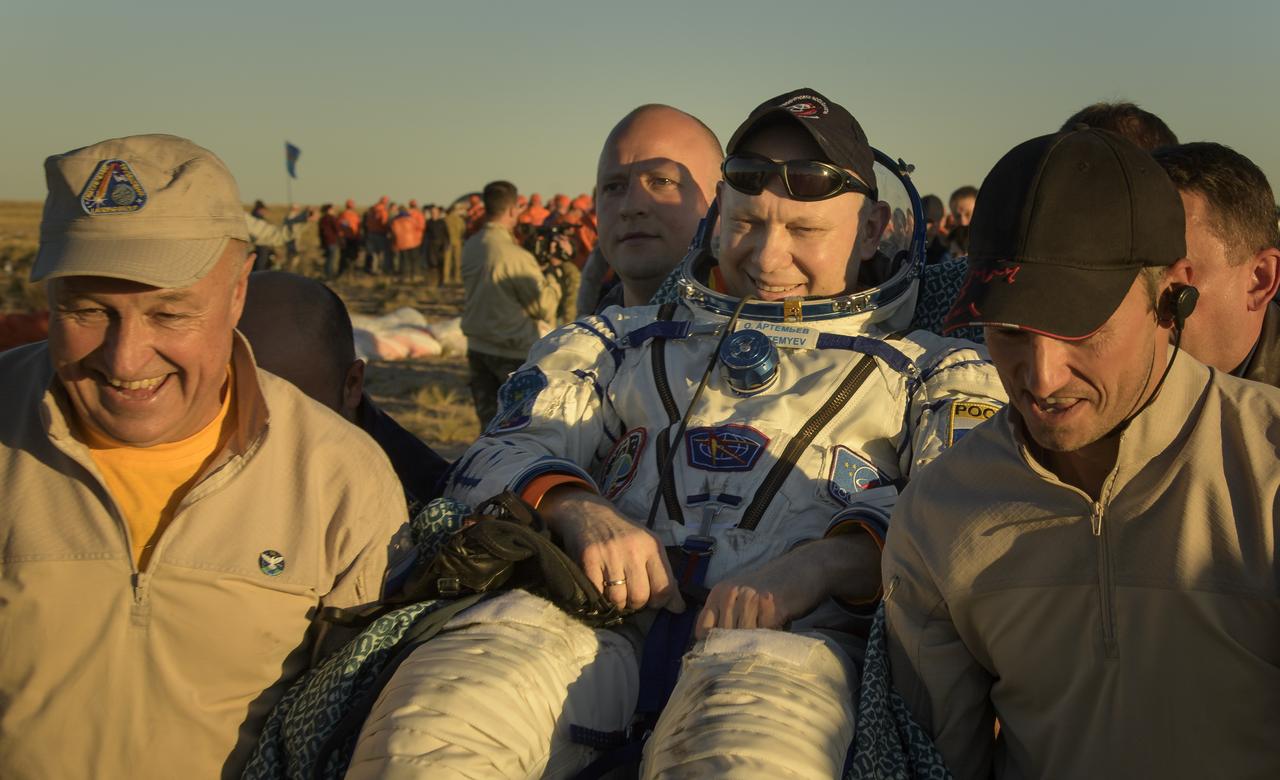 Expedition 56 Flight Engineer and Soyuz Commander Oleg Artemyev of Roscosmos is carried to a medical tent shortly after he, Expedition 56 Commander Drew Feustel, and Flight Engineer Ricky Arnold of NASA landed in their Soyuz MS-08 spacecraft near the town of Zhezkazgan, Kazakhstan on Thursday, Oct. 4, 2018. Feustel, Arnold, and Artemyev are returning after 197 days in space where they served as members of the Expedition 55 and 56 crews onboard the International Space Station. Photo Credit: (NASA/Bill Ingalls)