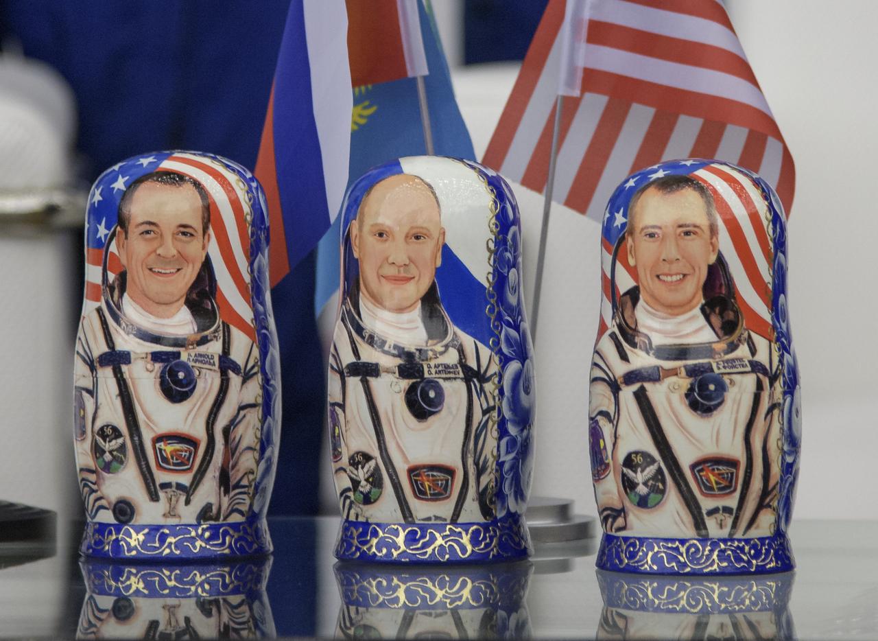 Matryoshka Dolls depicting Flight Engineer Ricky Arnold of NASA, left, Flight Engineer and Soyuz Commander Oleg Artemyev of Roscosmos, center, and Expedition 56 Commander Drew Feustel of NASA are seen at a Karaganda Airport welcome ceremony in Kazakhstan on Thursday, Oct. 4, 2018. Feustel, Arnold, and Artemyev are returning after 197 days in space where they served as members of the Expedition 55 and 56 crews onboard the International Space Station. Photo Credit: (NASA/Bill Ingalls)