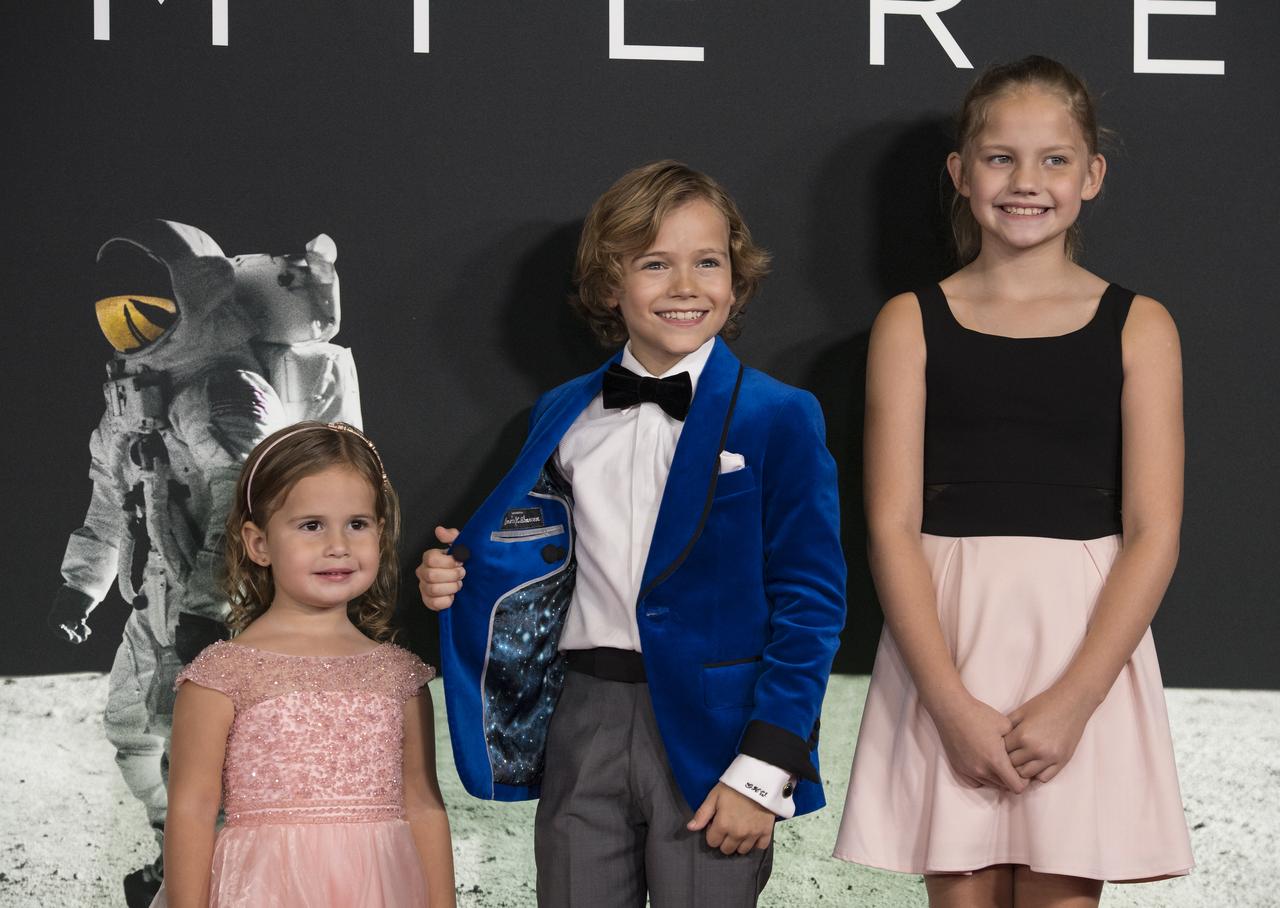 From left to right, American actress Lucy Brooke Stafford, American actor Gavin Warren, and American actress Claire Smith arrive on the red carpet for the premiere of the film "First Man" at the Smithsonian National Air and Space Museum Thursday, Oct. 4, 2018 in Washington. The film is based on the book by Jim Hansen, and chronicles the life of NASA astronaut Neil Armstrong from test pilot to his historic Moon landing. Photo Credit: (NASA/Aubrey Gemignani)