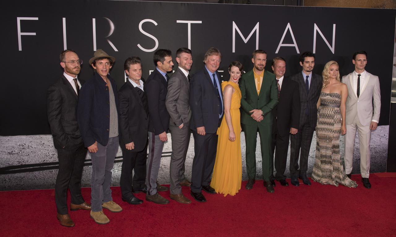 The cast of the film "First Man" pose for a photo after arriving on the red carpet for the premiere at the Smithsonian National Air and Space Museum Thursday, Oct. 4, 2018 in Washington. The film is based on the book by Jim Hansen, and chronicles the life of NASA astronaut Neil Armstrong from test pilot to his historic Moon landing. Photo Credit: (NASA/Aubrey Gemignani)