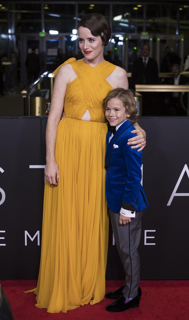 English actress Claire Foy, left, and actor Gavin Warren arrive on the red carpet for the premiere of the film "First Man" at the Smithsonian National Air and Space Museum Thursday, Oct. 4, 2018 in Washington. The film is based on the book by Jim Hansen, and chronicles the life of NASA astronaut Neil Armstrong from test pilot to his historic Moon landing. Photo Credit: (NASA/Aubrey Gemignani)