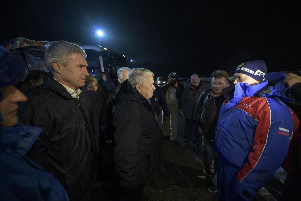 Officials, family, and friends gather to welcome home Expedition 56 Soyuz Commander Oleg Artemyev of Roscosmos, right, after he and NASA astronauts Drew Feustel and Flight Engineer Ricky Arnold landed their Soyuz MS-08 capsule near the town of Zhezkazgan, Kazakhstan on Friday, Oct. 5, 2018.  Artemyev, Feustel, and Arnold are returning after 197 days in space where they served as members of the Expedition 55 and 56 crews onboard the International Space Station. Photo Credit: (NASA/Bill Ingalls)