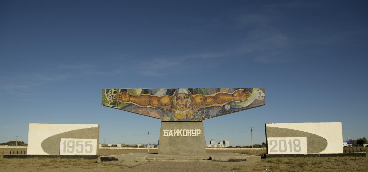 A mosaic sign welcoming visitors is seen outside the town of Baikonur, Kazakhstan, Monday, Oct. 8, 2018. Expedition 57 Flight Engineer Nick Hague of NASA and Flight Engineer Alexey Ovchinin of Roscosmos are scheduled to launch October 11 on a Soyuz rocket and will spend the next six months living and working aboard the International Space Station. Photo Credit: (NASA/Bill Ingalls)