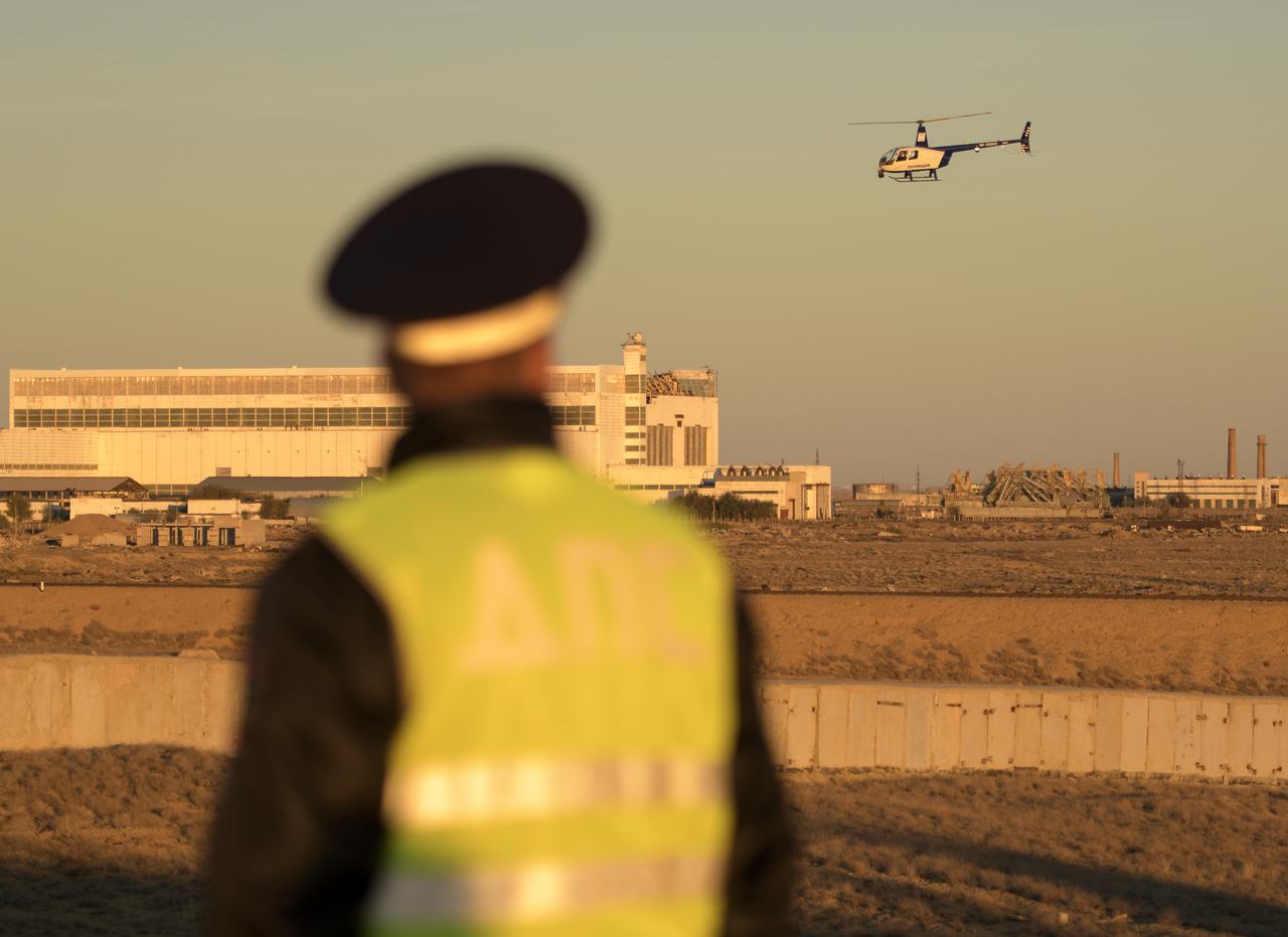 A security helicopter team surveys the train tracks in advance of the Soyuz rocket being rolled out to the launch pad, Tuesday, Oct. 9, 2018 at the Baikonur Cosmodrome in Kazakhstan. Expedition 57 crewmembers Nick Hague of NASA and Alexey Ovchinin of Roscosmos are scheduled to launch on October 11 and will spend the next six months living and working aboard the International Space Station. Photo Credit: (NASA/Bill Ingalls)