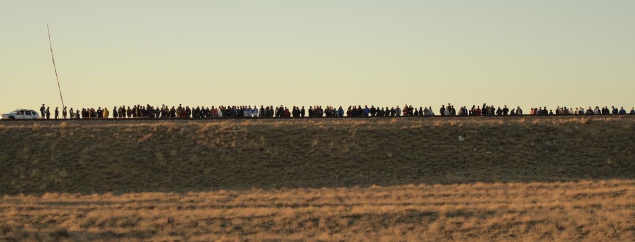 Invited guest, tourest and officials watch as the Soyuz rocket is rolled out by train to the launch pad, Tuesday, Oct. 9, 2018 at the Baikonur Cosmodrome in Kazakhstan. Expedition 57 crewmembers Nick Hague of NASA and Alexey Ovchinin of Roscosmos are scheduled to launch on October 11 and will spend the next six months living and working aboard the International Space Station. Photo Credit: (NASA/Bill Ingalls)