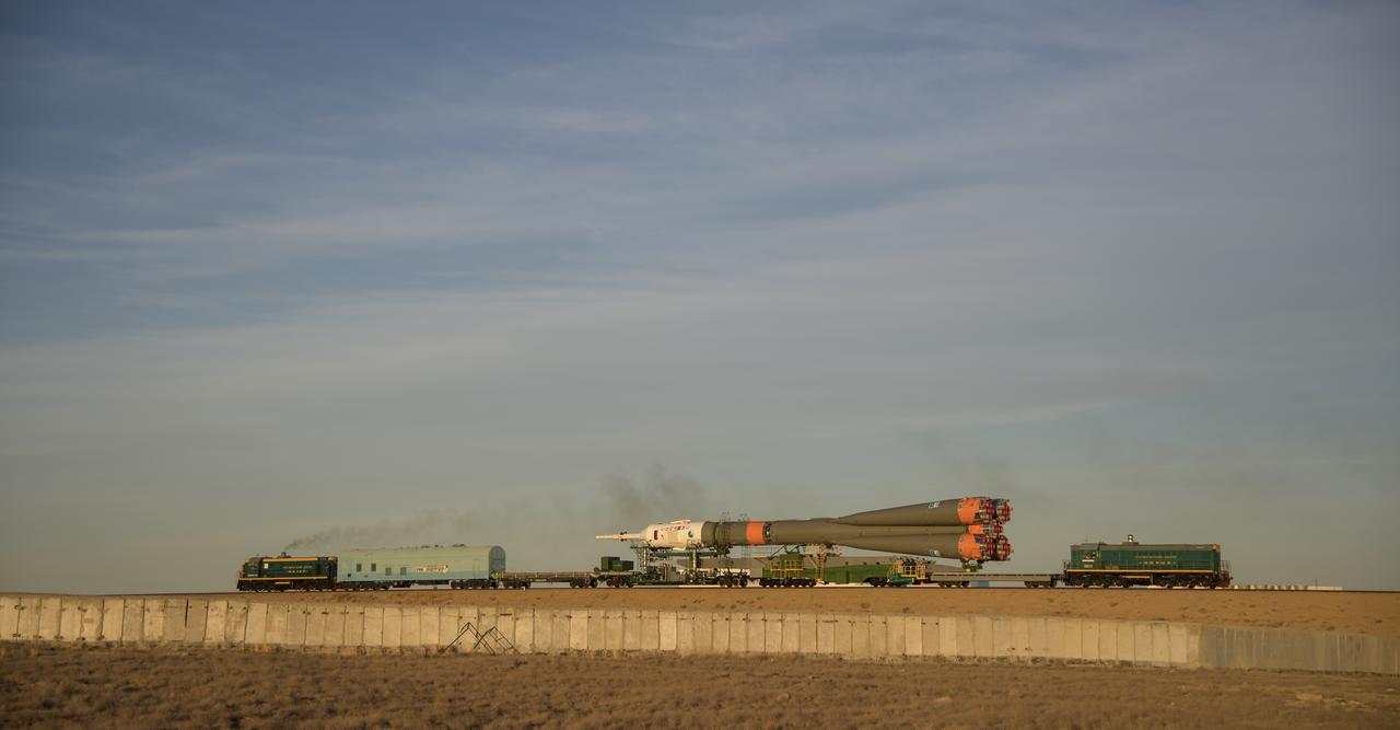 The Soyuz rocket is rolled out by train to the launch pad, Tuesday, Oct. 9, 2018 at the Baikonur Cosmodrome in Kazakhstan. Expedition 57 crewmembers Nick Hague of NASA and Alexey Ovchinin of Roscosmos are scheduled to launch on October 11 and will spend the next six months living and working aboard the International Space Station. Photo Credit: (NASA/Bill Ingalls)