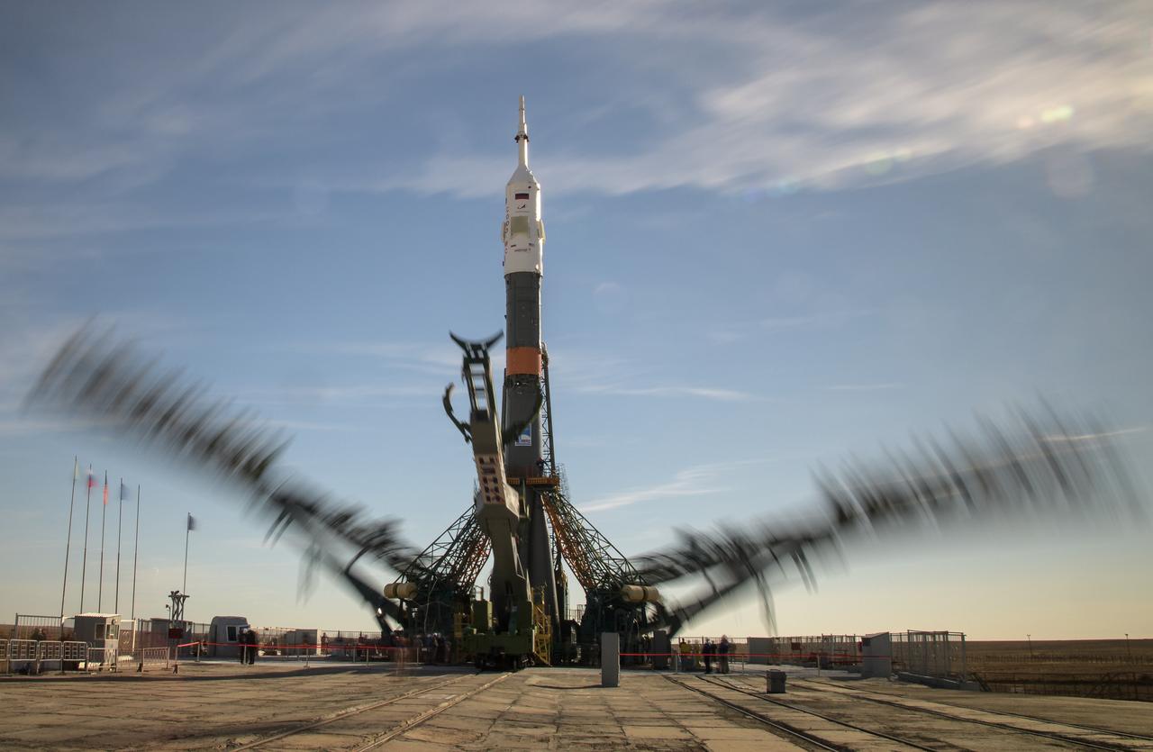 At the Baikonur Cosmodrome in Kazakhstan, launch pad gantry arms are seen closing around the Soyuz rocket in this long exposure photograph, Tuesday, Oct. 9, 2018. Expedition 57 crewmembers Nick Hague of NASA and Alexey Ovchinin of Roscosmos are scheduled to launch on October 11 on the Soyuz MS-10 spacecraft for a six-month mission living and working aboard the International Space Station. Photo Credit: (NASA/Bill Ingalls)