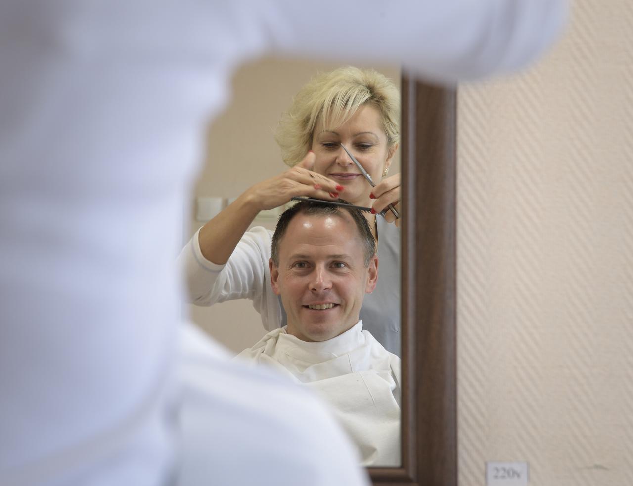 Expedition 57 Flight Engineer Nick Hague of NASA gets his hair cut, Tuesday, Oct. 9, 2018 at the Cosmonaut Hotel in Baikonur, Kazakhstan. Hague and Expedition 57 Flight Engineer Alexey Ovchinin of Roscosmos are scheduled to launch onboard a Soyuz rocket October 11 and will spend the next six months living and working aboard the International Space Station. Photo Credit: (NASA/Bill Ingalls)