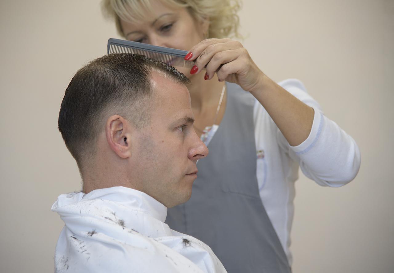 Expedition 57 Flight Engineer Nick Hague of NASA gets his hair cut, Tuesday, Oct. 9, 2018 at the Cosmonaut Hotel in Baikonur, Kazakhstan. Hague and Expedition 57 Flight Engineer Alexey Ovchinin of Roscosmos are scheduled to launch onboard a Soyuz rocket October 11 and will spend the next six months living and working aboard the International Space Station. Photo Credit: (NASA/Bill Ingalls)