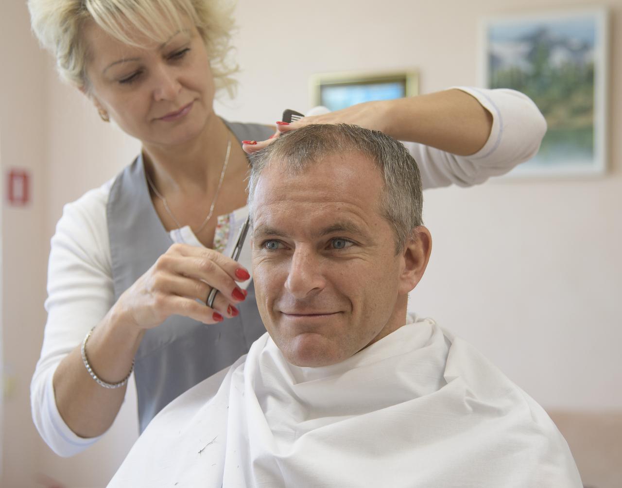 Expedition 57 backup crewmember David Saint-Jacques of the Canadian Space Agency gets his hair cut, Tuesday, Oct. 9, 2018 at the Cosmonaut Hotel in Baikonur, Kazakhstan. Expedition 57 Flight Engineer Nick Hague of NASA and Flight Engineer Alexey Ovchinin of Roscosmos are scheduled to launch onboard a Soyuz rocket October 11 and will spend the next six months living and working aboard the International Space Station. Photo Credit: (NASA/Bill Ingalls)