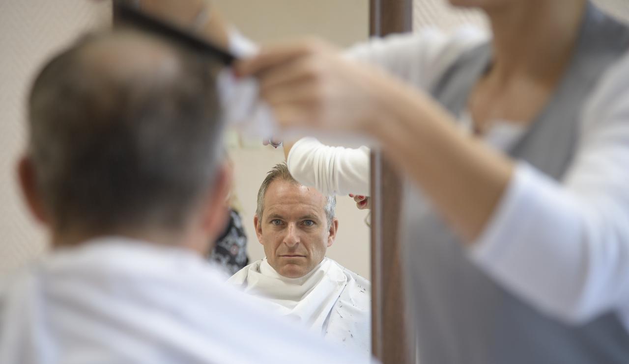 Expedition 57 backup crewmember David Saint-Jacques of the Canadian Space Agency gets his hair cut, Tuesday, Oct. 9, 2018 at the Cosmonaut Hotel in Baikonur, Kazakhstan. Expedition 57 Flight Engineer Nick Hague of NASA and Flight Engineer Alexey Ovchinin of Roscosmos are scheduled to launch onboard a Soyuz rocket October 11 and will spend the next six months living and working aboard the International Space Station. Photo Credit: (NASA/Bill Ingalls)