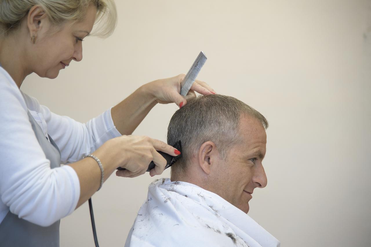 Expedition 57 backup crewmember David Saint-Jacques of the Canadian Space Agency gets his hair cut, Tuesday, Oct. 9, 2018 at the Cosmonaut Hotel in Baikonur, Kazakhstan. Expedition 57 Flight Engineer Nick Hague of NASA and Flight Engineer Alexey Ovchinin of Roscosmos are scheduled to launch onboard a Soyuz rocket October 11 and will spend the next six months living and working aboard the International Space Station. Photo Credit: (NASA/Bill Ingalls)