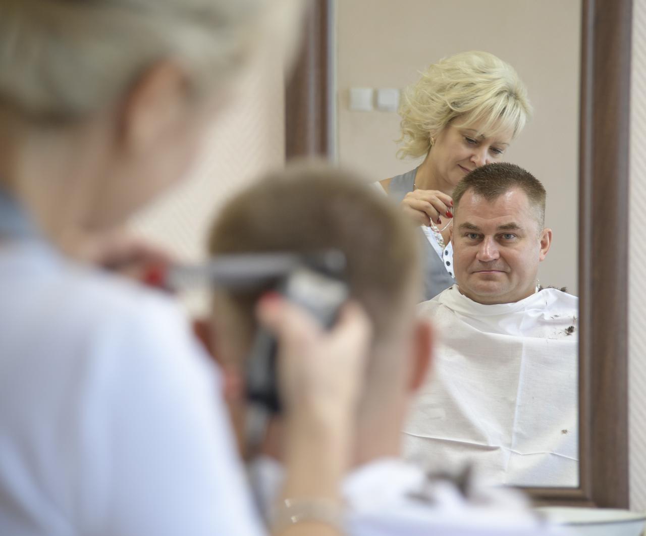 Expedition 57 Flight Engineer Alexey Ovchinin of Roscosmos gets his hair cut, Tuesday, Oct. 9, 2018 at the Cosmonaut Hotel in Baikonur, Kazakhstan. Ovchinin and Expedition 57 Flight Engineer Nick Hague of NASA are scheduled to launch onboard a Soyuz rocket October 11 and will spend the next six months living and working aboard the International Space Station. Photo Credit: (NASA/Bill Ingalls)